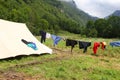 clothes hanging out to dry in the sun near the tent at a boys scout campsite