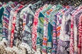 Clothes hanging on a rack in a flea market Souvenir shop in Thailand Royalty Free Stock Photo