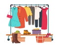 Clothes hanging on rack, garment rail with casual women clothing. Fashion girl wardrobe, female clothes on hangers Royalty Free Stock Photo