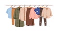 Clothes hanging on rack, hanger rail. Casual female wardrobe, modern garments hanging. Modern women apparel, wearing