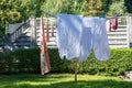 Clothes hanging on rack to dry outdoors in summer Royalty Free Stock Photo