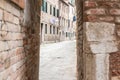 Clothes hanging to dry at the green windows of the brick building in Venice, Italy Royalty Free Stock Photo