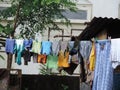 Clothes hanging to dry outside a small house in a village in India - rural India scene Royalty Free Stock Photo