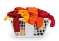 Clothes in laundry basket. Red, orange, yellow.