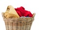 Clothes in a laundry wicker basket isolated on white background Royalty Free Stock Photo