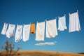 Clothes on a line dance in the wind, drying naturally Royalty Free Stock Photo