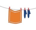 Clothes line with hanging washed orange clothes dish cloth and b Royalty Free Stock Photo