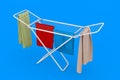 Clothes over White Folding Metal Clothes Drying Rack. 3d Rendering