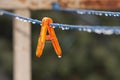 Clothes peg with water drops after rain Royalty Free Stock Photo