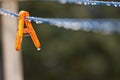 Clothes peg with water drops after rain Royalty Free Stock Photo