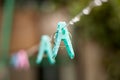 Clothes peg with water drops after rain in the morning. Royalty Free Stock Photo