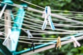 Clothes pegs on the clothesline. Drying the laundry outside. Selective focus Royalty Free Stock Photo