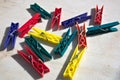 Clothes pegs of colored plastic under the sun Royalty Free Stock Photo