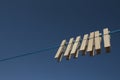 Clothes pegs on a drying laundry line detail Royalty Free Stock Photo