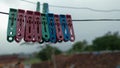 Clothes pegs hangging on the clothesline Royalty Free Stock Photo