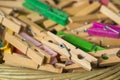 Clothes pegs made of wood and plastic colors Royalty Free Stock Photo