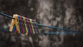Colorful clothes pin on a blue rope Royalty Free Stock Photo