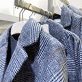 Clothes On a Rack, Stylish jackets on hangers, Clothing store, autumn and winter collection