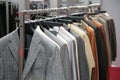 Clothes on racks in shop Royalty Free Stock Photo