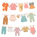 Clothes on ropes. Baby dress, infant cloth hang on rope. Cute children clothing after washing on clothesline, isolated