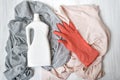 Clothes, rubber glove and bottle with detergent. Top view Royalty Free Stock Photo
