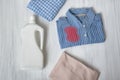 Clothes with stains and a bottle of detergent. Top view Royalty Free Stock Photo