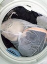 Clothes in the washing net in the washing machine tube
