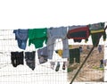 Clothesline in detained refugees, barb wire fence with clothes