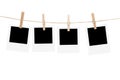 Clothesline with empty picture frames and clothespins on a white background