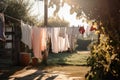 clothesline with freshly washed towels and linens drying in the sun Royalty Free Stock Photo