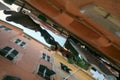 Clothesline between the houses in a narrow alley in a typical italian old town, view from below, porto venere, liguria, italy Royalty Free Stock Photo