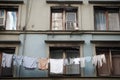 clothesline with laundry hanging out a window in the city