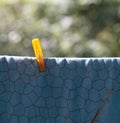 Clothespin on blue bedsheet