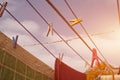 A clothespin hangs on the washing line. A rope with clean linen and clothes outdoors on the day of the laundry. Against the Royalty Free Stock Photo