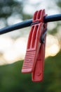 clothespin vivid color red hook on cable Royalty Free Stock Photo