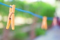 clothespins on a blue line, generous copy space on the blurry background, selected focus, narrow depth of field