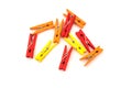 Clothespins For Clothes. Red, Yellow And Orange On White Background