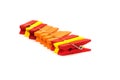 clothespins for clothes. red, yellow and orange on white background Royalty Free Stock Photo