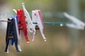 Clothespins on a clothesline with raindrops Royalty Free Stock Photo