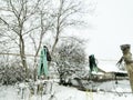 Clothespins in the cold hang on a wire outside. Royalty Free Stock Photo