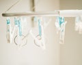 The Clothespins hang on a white Clothes line Royalty Free Stock Photo