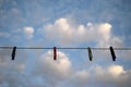 Clothespins hanging on a wire Royalty Free Stock Photo