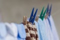 Clothespins holding clothes on the clothesline