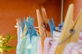 Clothespins holding clothes in the sun drying after washing. Selective Focus Royalty Free Stock Photo