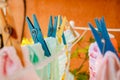 Clothespins holding clothes in the sun drying after washing. Selective Focus Royalty Free Stock Photo