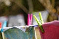 Clothespins holding laundry on the drying line Royalty Free Stock Photo