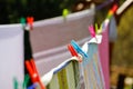 Clothespins holding laundry on the drying line Royalty Free Stock Photo
