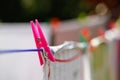 Clothespins holding laundry on the drying line Royalty Free Stock Photo