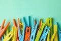 Clothespins on mint background, space for text Royalty Free Stock Photo