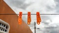 clothespins on rope. clothespin on the clothesline on cloudy day Royalty Free Stock Photo